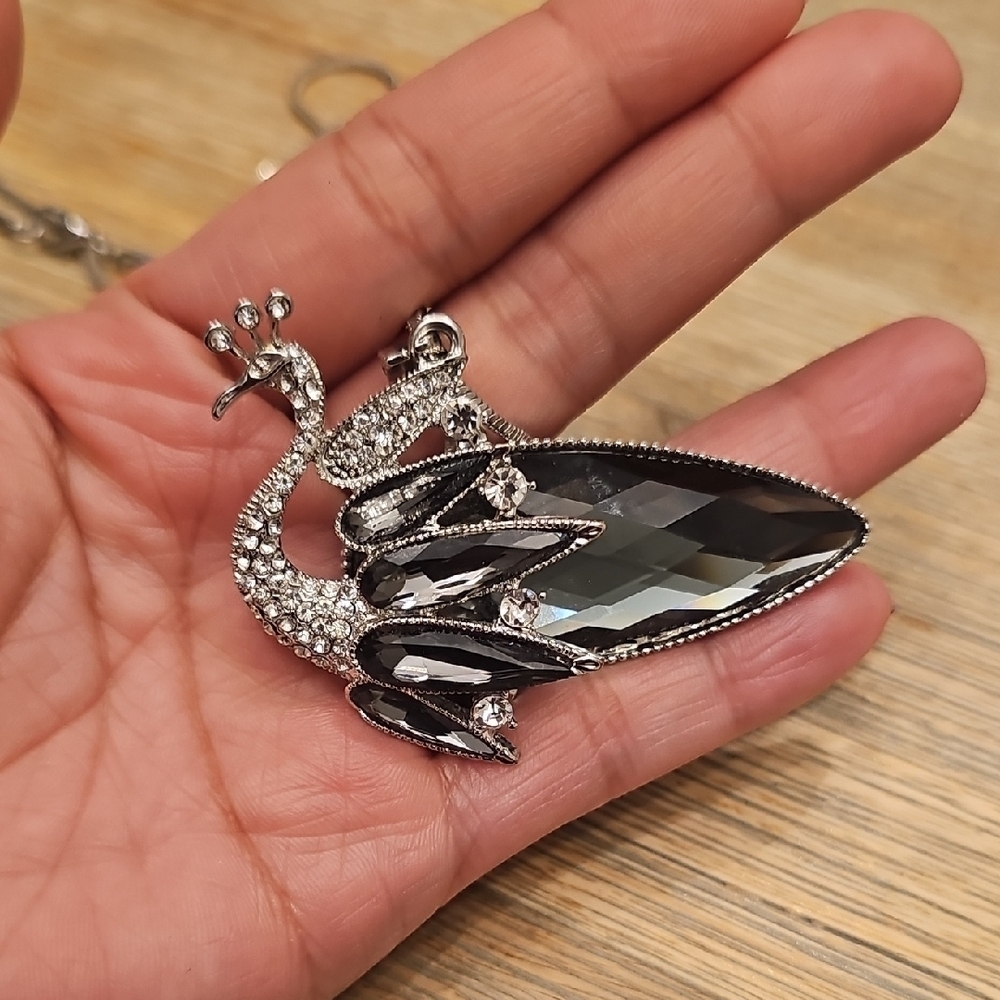 Elegant Silver and Black Peacock Pendant